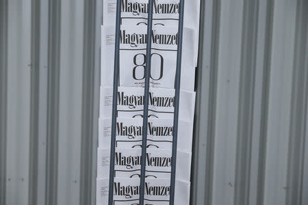 Copies of the last edition of Hungarian broadsheet daily Magyar Nemzet, will close its operations from Wednesday after 80 years in print, are printed in a printing house in Budapest, Hungary, April 10, 2018. REUTERS/Balazs Szekelyhidi/Magyar Nemzet