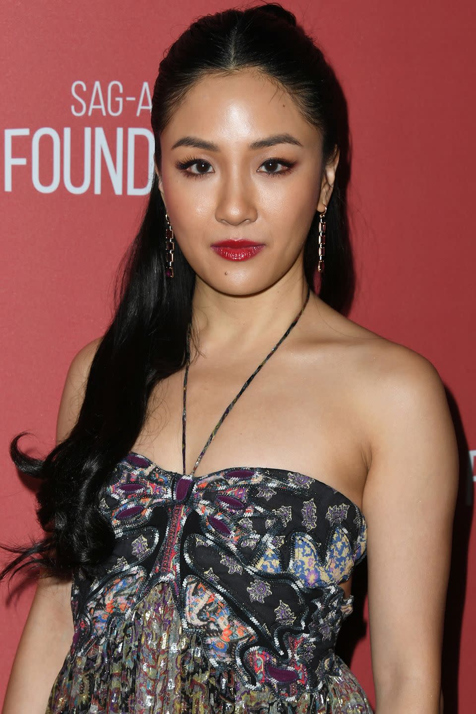 <p>If you're a fan of a middle part, wear your half-up hairstyle like Constance Wu.</p>