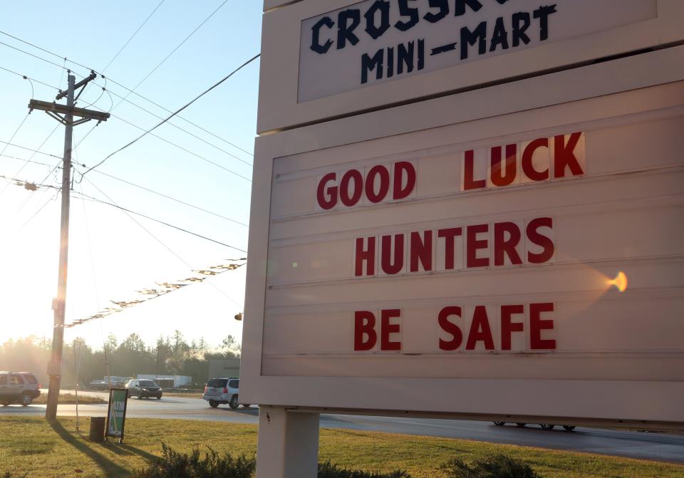 A sign at a gas station just outside of Marquette, Michigan, greets hunters driving by or gassing up for the opening day of deer season on Nov. 14, 2013.