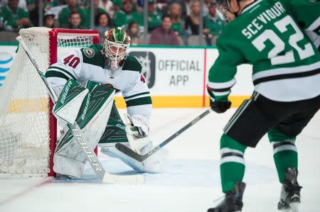 Apr 22, 2016; Dallas, TX, USA; Minnesota Wild goalie Devan Dubnyk (40) stops a shot by Dallas Stars center Colton Sceviour (22) during the second period in game five of the first round of the 2016 Stanley Cup Playoffs at the American Airlines Center. Mandatory Credit: Jerome Miron-USA TODAY Sports