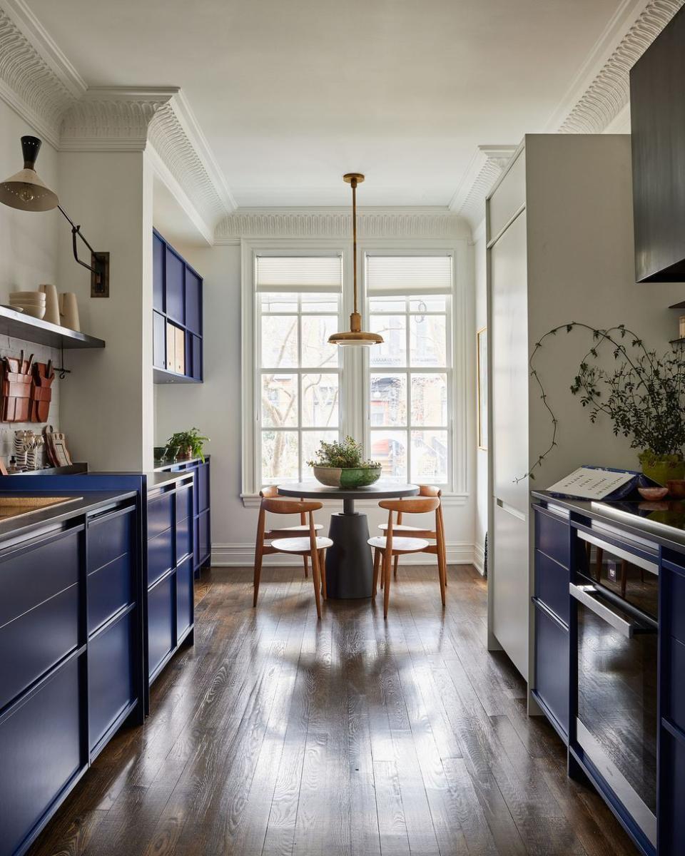 a kitchen with a table and chairs