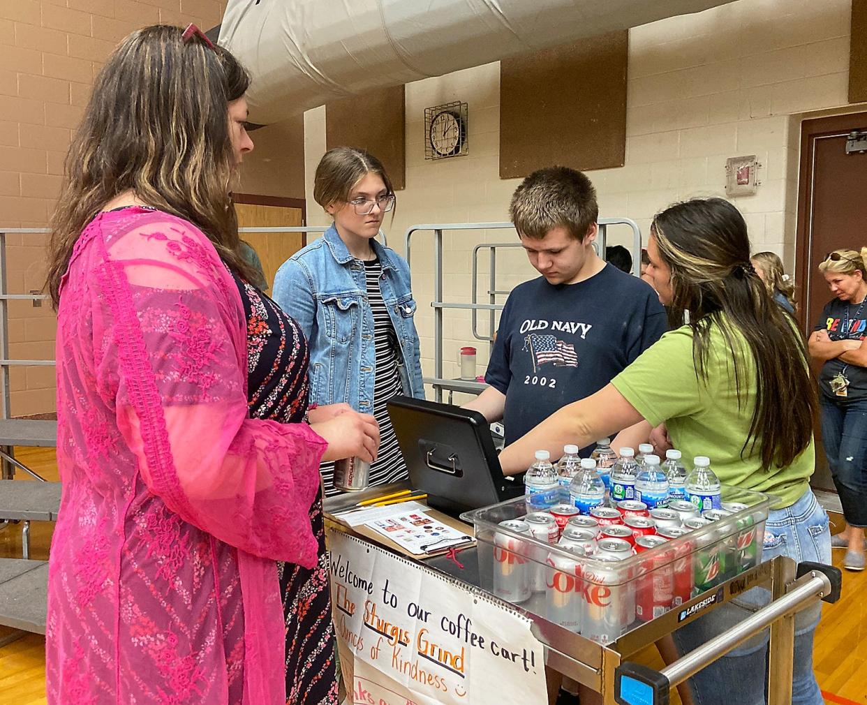 Sturgis Middle School students served beverages from a coffee cart to members of Sturgis Public Schools Board of Education, at the board's meeting Monday.