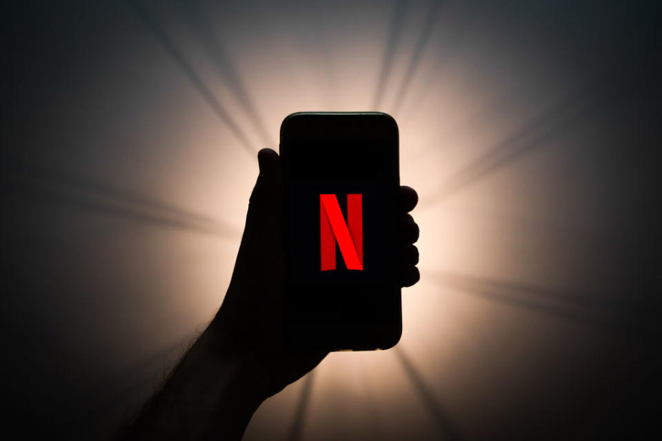 Pictured: Silhouetted hand with Netflix 'N' sign. Image: Getty