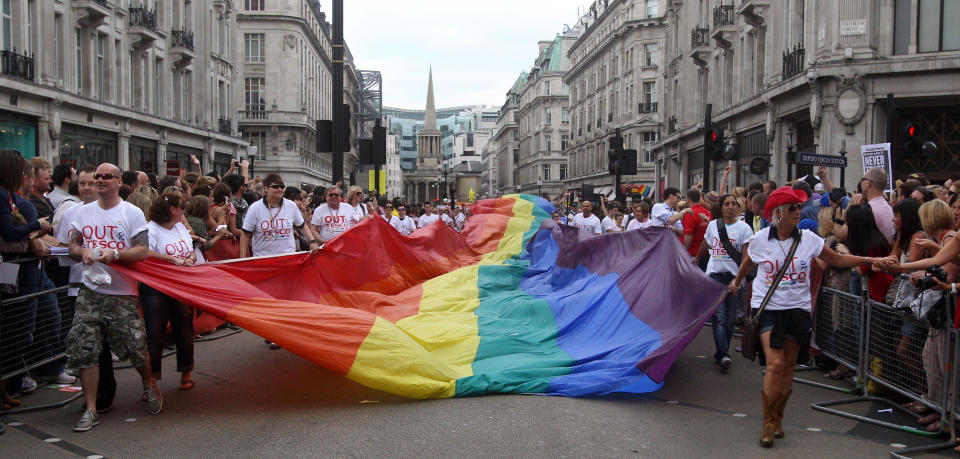 Revellers take part in the annual Gay Pride parade, in central London.