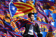 <p>A FC Barcelona fan waves the so-called Estelada flag, Catalunya’s separatist unofficial flag, hours before the start of the Spanish King’s Cup final between FC Barcelona and Sevilla FC at the Vicente Calderon stadium in Madrid, Spain, May 22, 2016. (JUAN CARLOS HIDALGO/EPA) </p>