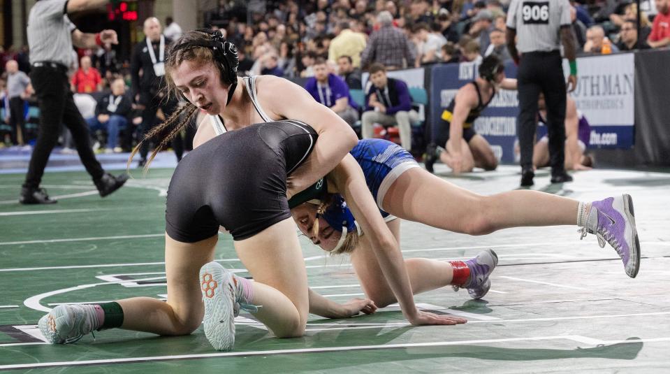 Howell's Kylie Gudewitz (right) defeated Colts Neck's Alexandra Tchekounova 4-0 in the NJSIAA 114-pound semifinal.