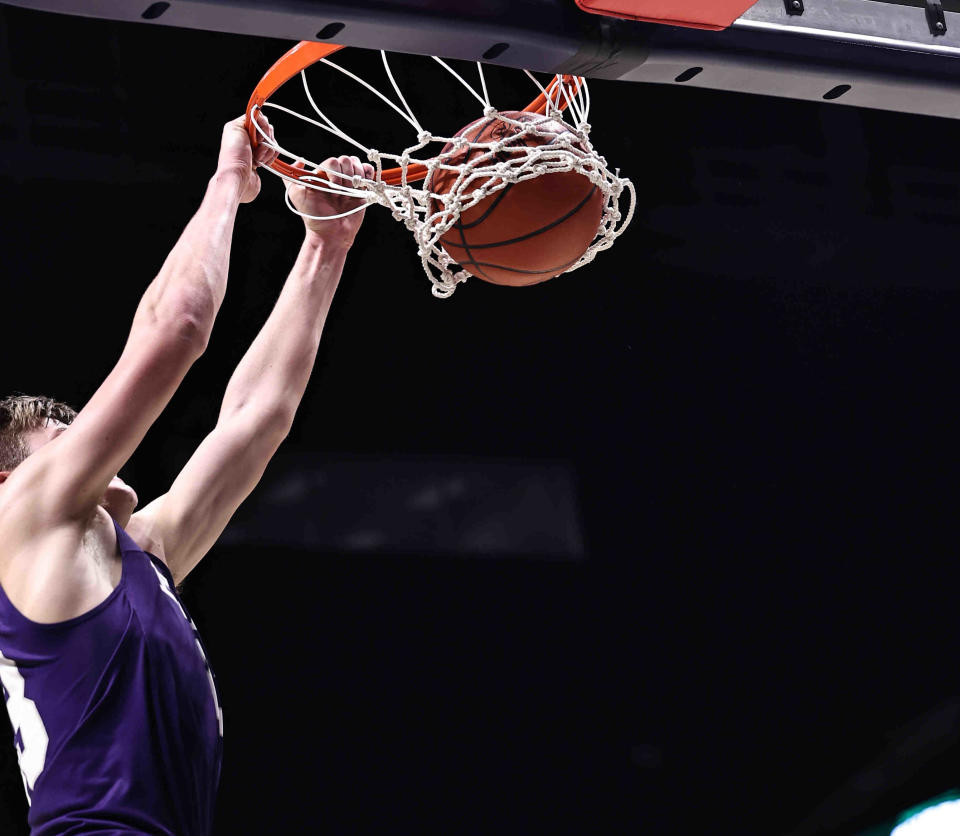 Elder forward Tyler Johnson dunks during the Panthers district final win over Wayne Sunday March 10, 2024.