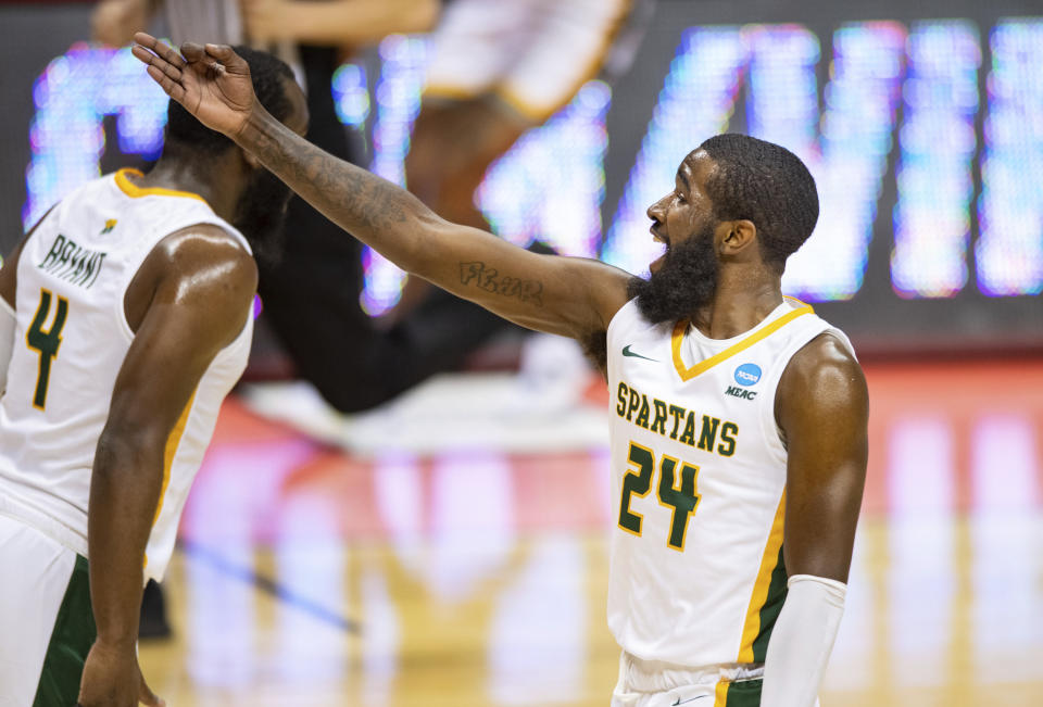 Norfolk State guard Jalen Hawkins (24) reacts after scoring a three-point basket during the first half of a First Four game against Appalachian State in the NCAA men's college basketball tournament, Thursday, March 18, 2021, in Bloomington, Ind. (AP Photo/Doug McSchooler)