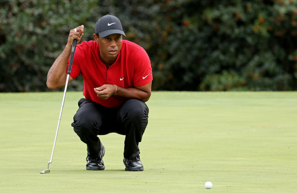 AUGUSTA, GEORGIA - NOVEMBER 15: Tiger Woods of the United States lines up a putt on the 14th green during the final round of the Masters at Augusta National Golf Club on November 15, 2020 in Augusta, Georgia. (Photo by Jamie Squire/Getty Images)