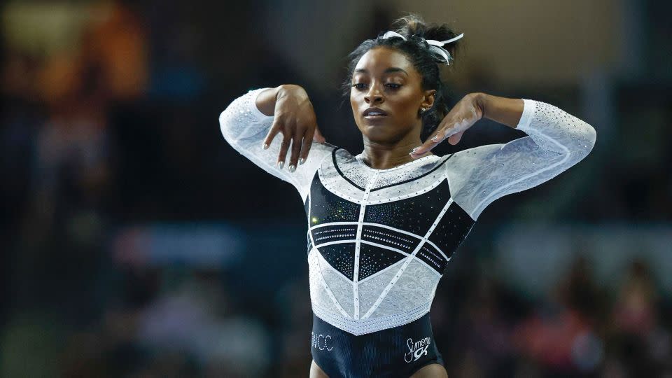 Simone Biles performs on the balance beam. - Kamil Krzaczynski/AFP/Getty Images