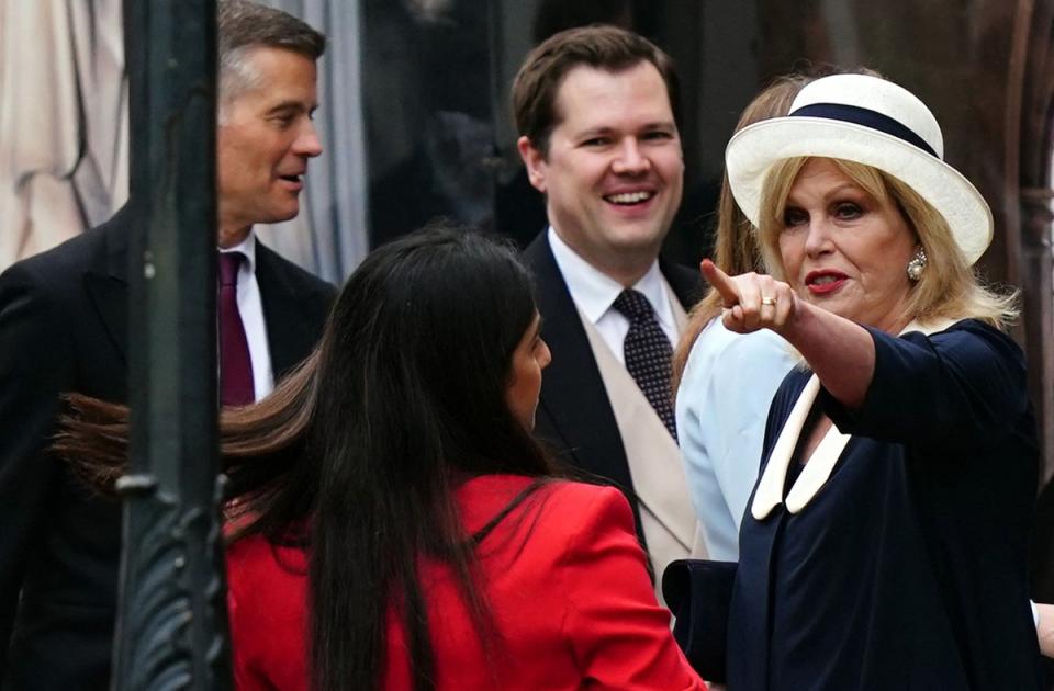 Joanna Lumley, talking with Tory politicians outside the abbey before heading inside for the coronation (POOL/AFP via Getty Images)