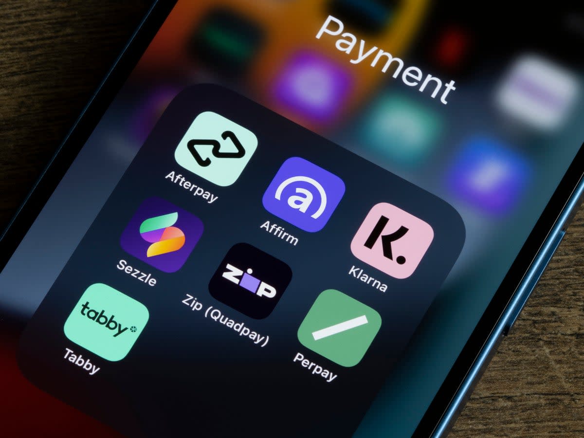 Assorted payment apps offering Buy Now Pay Later services are seen on an iPhone, including Afterpay, Affirm, Klarna, Sezzle, Zip (Quadpay), Perpay, and Tabby (Getty)
