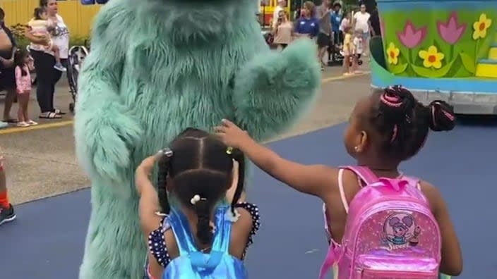 In this image from video provided by Jodi Brown, posted to Instagram on July 16, a performer dressed as the character Rosita waves off Brown’s daughter and another 6-year-old Black girl at the Sesame Place amusement park. (Photo: Jodi Brown via AP)