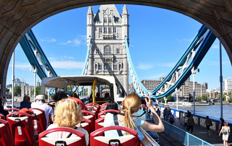 Women on double-decker open-top London tour bus