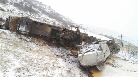 The aftermath of a freight train collision in northern Utah January 8, 2014 is pictured in this Utah Highway Patrol handout photo. REUTERS/Lt. Chris Simmons/Utah Highway Patrol/Handout