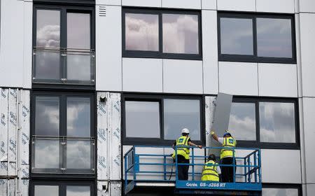 Cladding is removed from the side of Whitebean Court in Salford, Manchester, Britain June 26, 2017. REUTERS/Andrew Yates