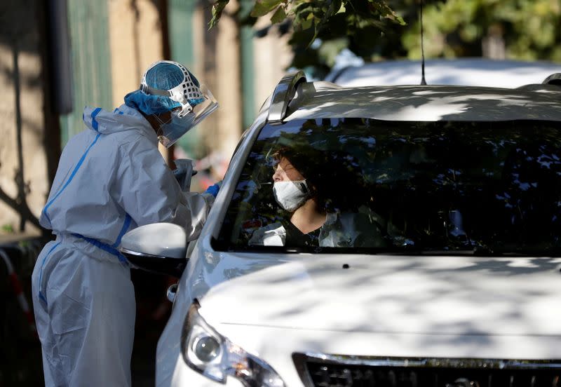 A woman gets tested for the coronavirus disease in Prague