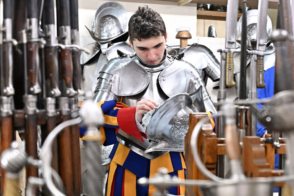 A soldier prepares for the oath of the Pontifical Swiss Guard in the Swiss Guard barracks in Vatican City, on April 30, 2024.