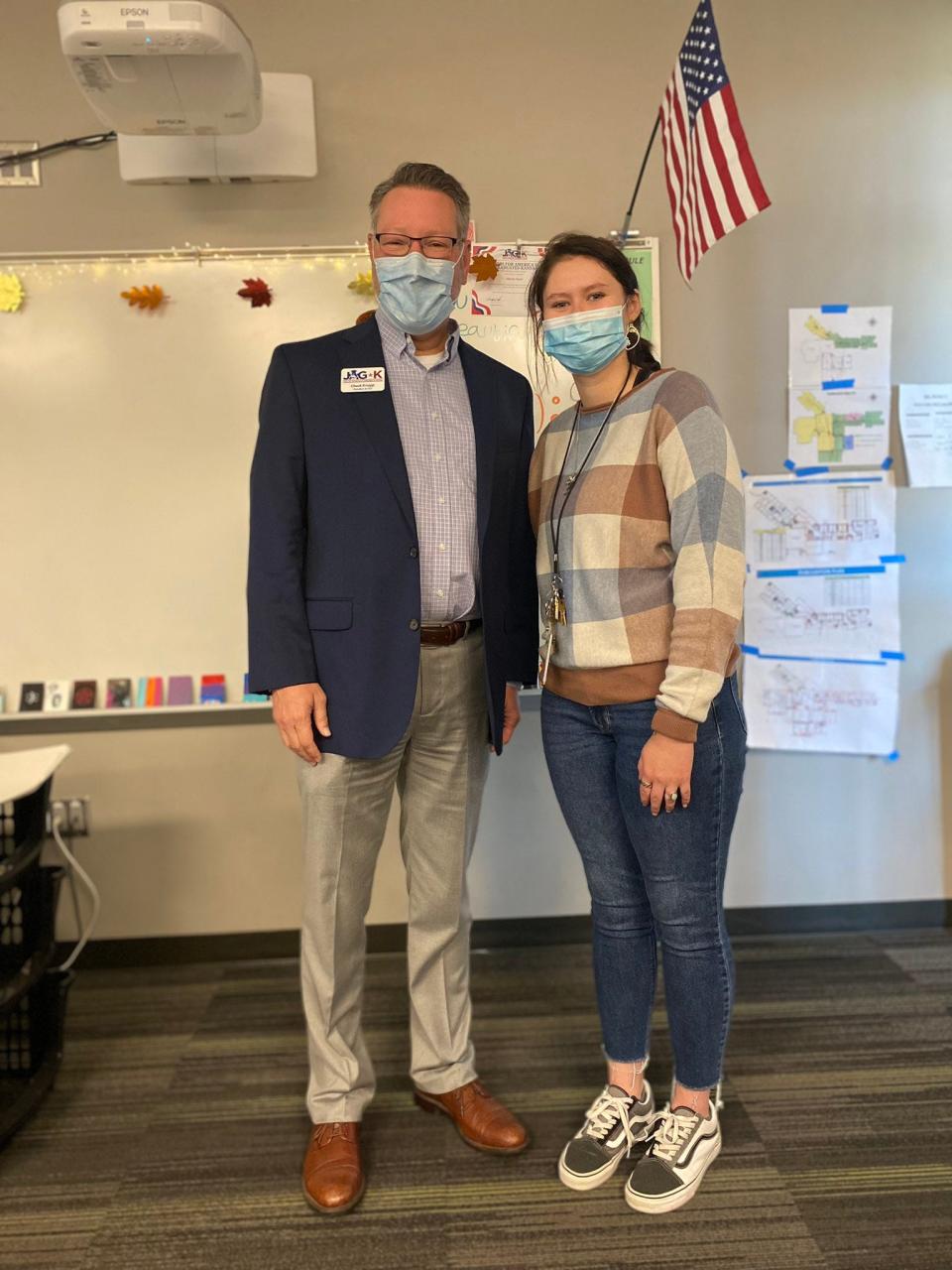 Paiger Parker, pictured here with JAG-K President and CEO Chuck Knapp, is the new career specialist at Salina South High School, where she graduated from in 2016. She took on the role after being a participant in the JAG-K program herself as a student.