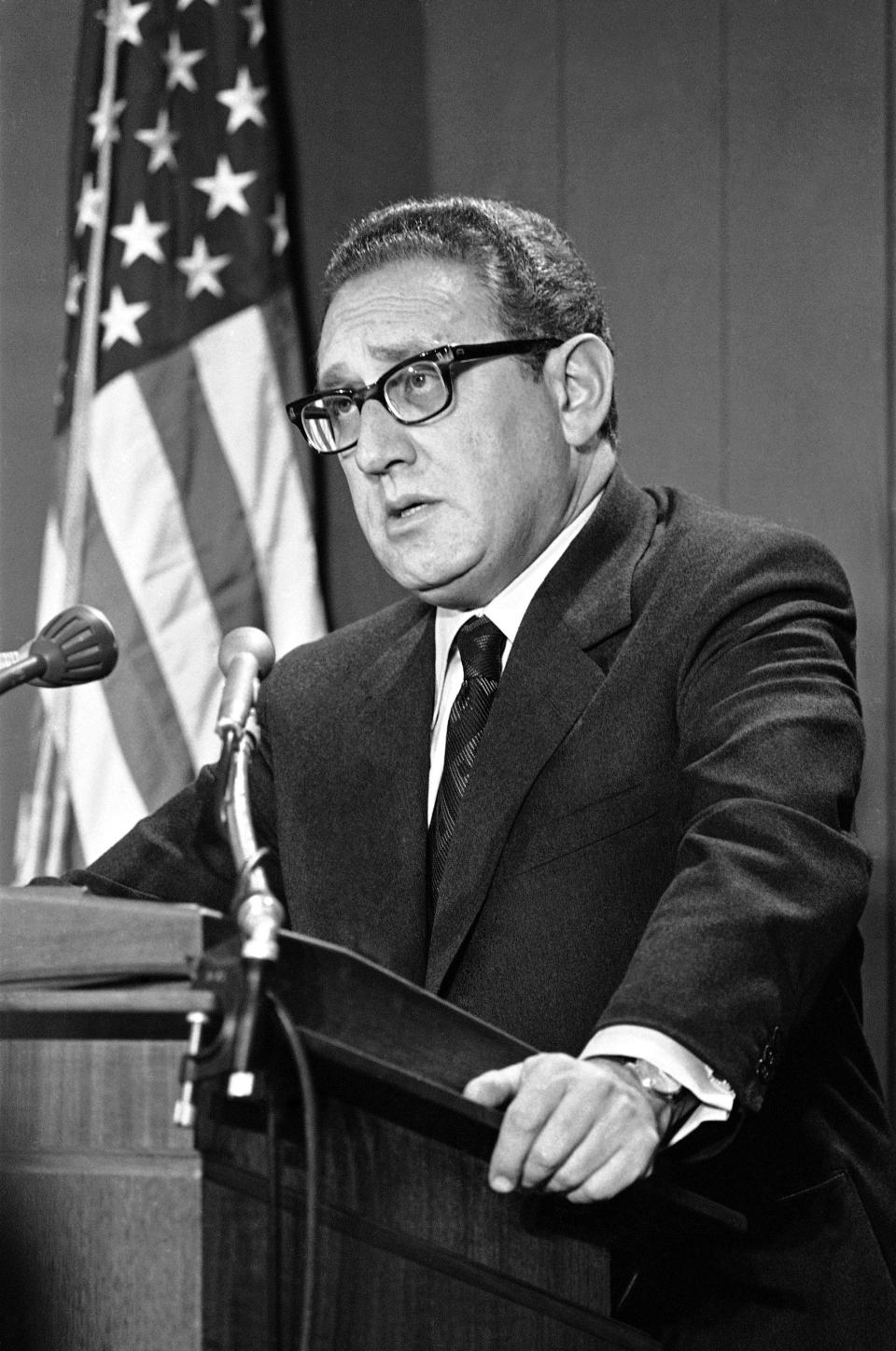 Secretary of State Henry Kissinger briefs newsmen on the Middle East peace situation and oil boycott during a news conference in Washington, Thursday, Dec. 7, 1973. (AP Photo)
