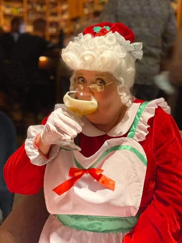 Mrs. Claus enjoying herself at SantaCon.