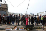 Civilians queue for humanitarian aid packages in Al Ghizlane district as the battle against Islamic State's fighters continues in Mosul. REUTERS/Youssef Boudlal