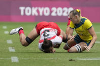 Australia's Maddison Levi, right, collides with Japan's Miyu Shirako in their women's rugby sevens match at the 2020 Summer Olympics, Thursday, July 29, 2021 in Tokyo, Japan. (AP Photo/Shuji Kajiyama) Japan's Miyu Shirako