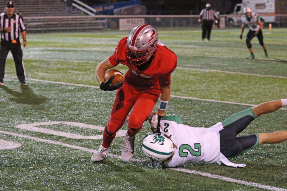 SJCC's Jackson Wright slips a tackle.