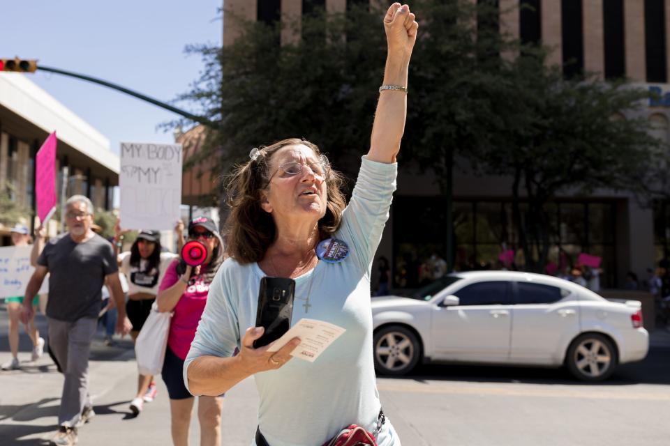 Abortion advocates joined the El Paso County Democratic Party on a march in Downtown El Paso to demand affordable healthcare, including abortion.