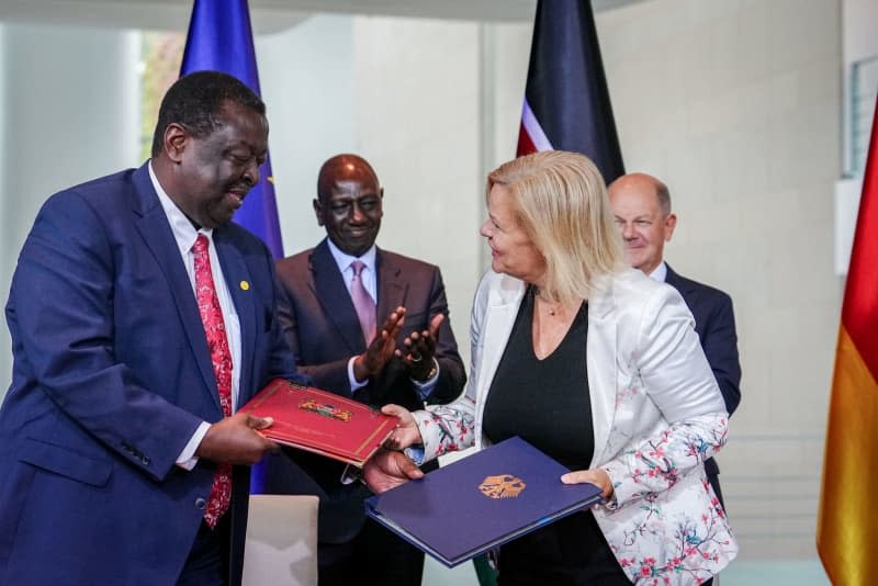 In the presence of German Chancellor Olaf Scholz (R) and President of Kenya William Samoei Ruto (2nd L), Nancy Faeser (2nd R), German Minister of the Interior and Home Affairs, and Musalia Mudavadi (L), Foreign Minister of Kenya, sign a migration agreement at the Federal Chancellery. The agreement is intended to promote the recruitment of skilled workers from Kenya and facilitate the repatriation of rejected asylum seekers from Germany to the East African country. Kay Nietfeld/dpa