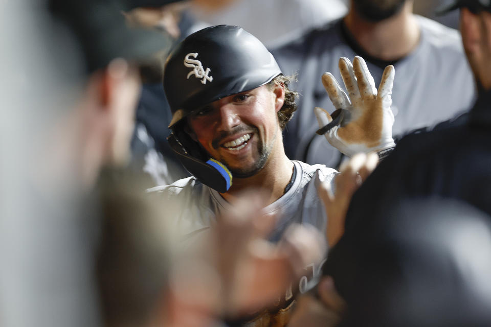 Chicago White Sox's Dominic Fletcher celebrates in the dugout after hitting a two-run double off Cleveland Guardians pitcher Scott Barlow during the eighth inning of a baseball game, Tuesday, April 9, 2024, in Cleveland. (AP Photo/Ron Schwane)