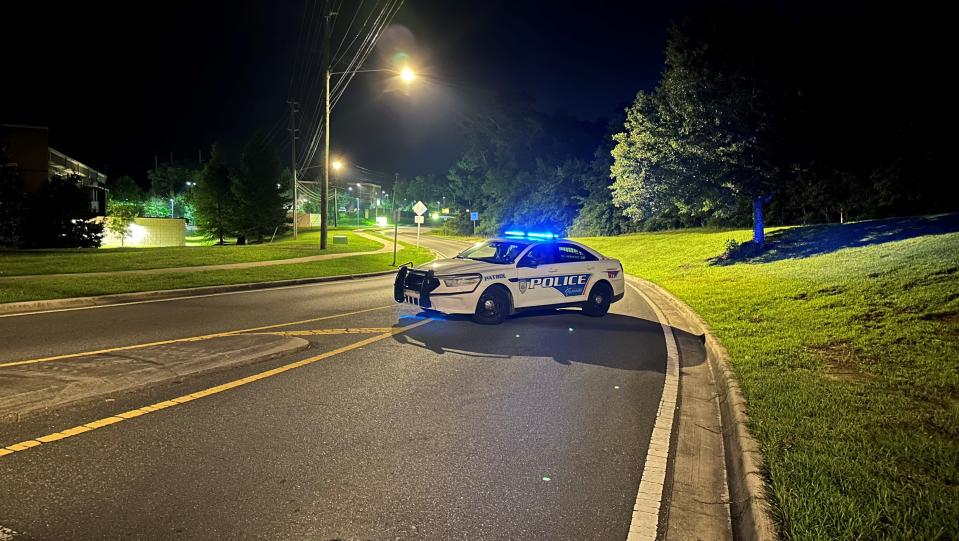 A Tallahassee Police Department officer blocks the entrance to Tom Brown Park at the roundabout near Easterwood Drive and Weems Road around 2:30 a.m. Friday, May 26, 2023. According to TPD, a woman opened fire and "ambushed" officers in the park Thursday night. Officers returned fire, striking and killing the woman.