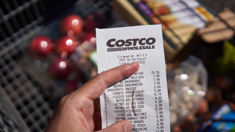 hand holding Costco receipt