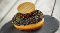<p>Over at the Donut Box, there are three new food items that pair wonderfully with a glass of rosé or a coffee cocktail. Try the chocolate-dipped donut with black and gold sugar sprinkles and chocolate buttercream.</p> <p><strong>Other new food items available at the Donut Box:</strong></p> <p>Inside out donut: a vanilla donut with Bavarian cream</p> <p>Vanilla donut with strawberry sugar, strawberry ice cream, fresh strawberries and strawberry gele</p> <p><strong>And beverages:</strong></p> <p>Quady Wines Electra Moscato Rosé (California)</p> <p>Cold fashion coffee cocktail</p>