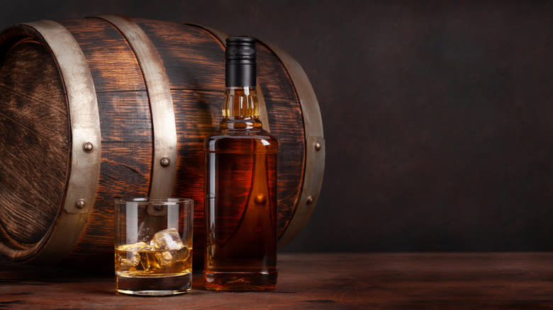 scotch whiskey barrel and bottle