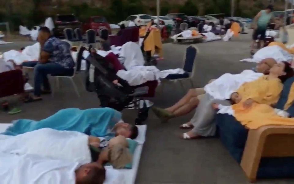 People camp outside after a quake in Akyarlar, Bodrum - Credit: REUTERS