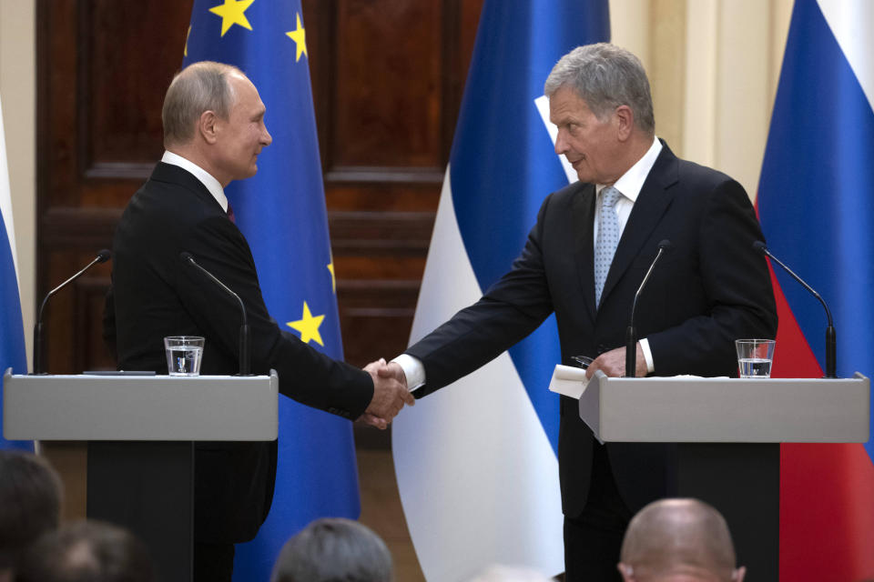 HELSINKI, Aug. 22, 2019 -- Russian President Vladimir Putin L shakes hands with Finnish President Sauli Niinisto during their joint press conference in Helsinki on Aug. 21, 2019. Russian President Vladimir Putin said here on Wednesday that Russia would like to see its relations with the European Union (EU) to 