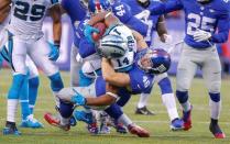 Dec 20, 2015; East Rutherford, NJ, USA; New York Giants linebacker James Morris (46) tackles Carolina Panthers quarterback Joe Webb (14) for loss during the fourth quarter at MetLife Stadium. Mandatory Credit: Jim O'Connor-USA TODAY Sports