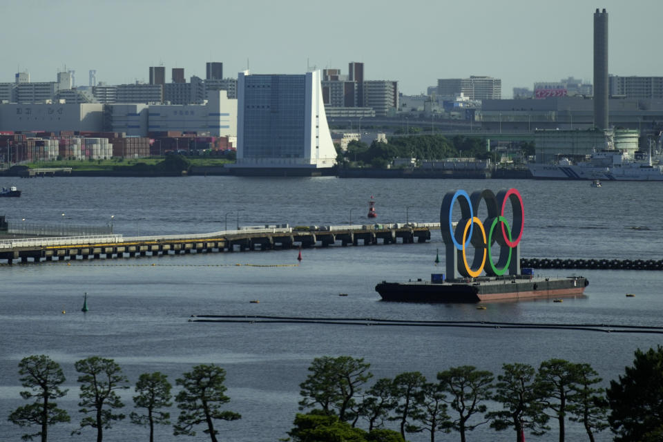 The Olympic Rings float on a barge at Odaiba Marine Park as Tokyo prepares for the 2020 Summer Olympics, Friday, July 16, 2021. The pandemic-delayed games open on July 23 without spectators at most venues. (AP Photo/Charlie Riedel)