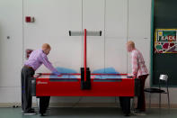 <p>Emmanuel Rutema, 15, and Pendo Noni 16, (R) play air hockey as they wait to have lunch after a prosthetic fitting at the Shriners Hospital in Philadelphia, Pa., May 30, 2017. Rutema and Noni are Tanzanians with albinism who had body parts chopped off in witchcraft-driven attacks. (Photo: Carlo Allegri/Reuters) </p>