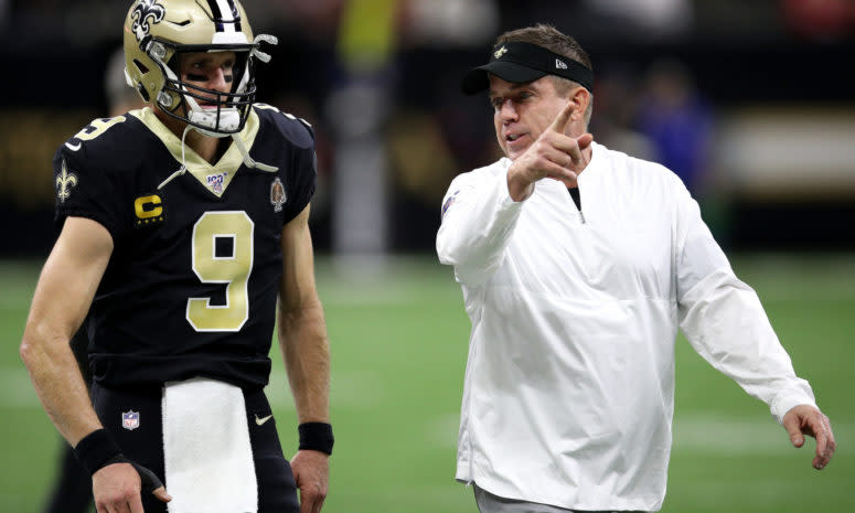 Sean Payton talking to Drew Brees before a Saints game.