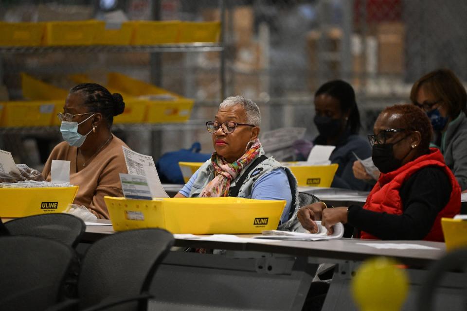 Poll workers process ballots at an elections warehouse outside of Philadelphia on Nov. 8, 2022. <a href="https://media.gettyimages.com/id/1244610615/photo/us-vote-election-pennsylvania.jpg?s=612x612&w=gi&k=20&c=q4DnoVs3m2XTD4Jw6FsOZdsZlU0pXDH2QlO-xdhn2Po=" rel="nofollow noopener" target="_blank" data-ylk="slk:Ed Jones/AFP via Getty Images;elm:context_link;itc:0;sec:content-canvas" class="link ">Ed Jones/AFP via Getty Images</a>