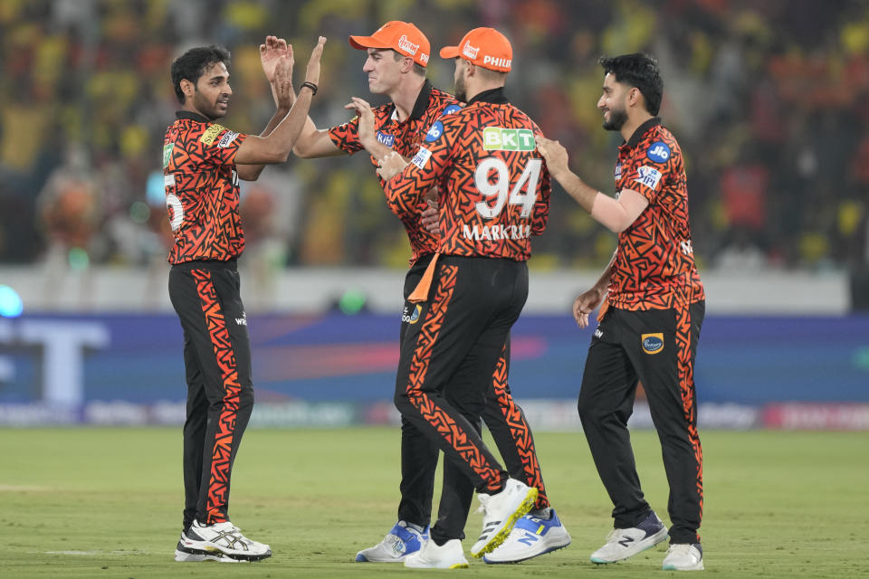 Sunrisers Hyderabad's Bhuvneshwar Kumar, left, celebrates with teammates after the dismissal of Chennai Super Kings' Rachin Ravindra during the Indian Premier League cricket match between Sunrisers Hyderabad and Chennai Super Kings in Hyderabad, India, Friday, April 5, 2024. (AP Photo/Mahesh Kumar A.)