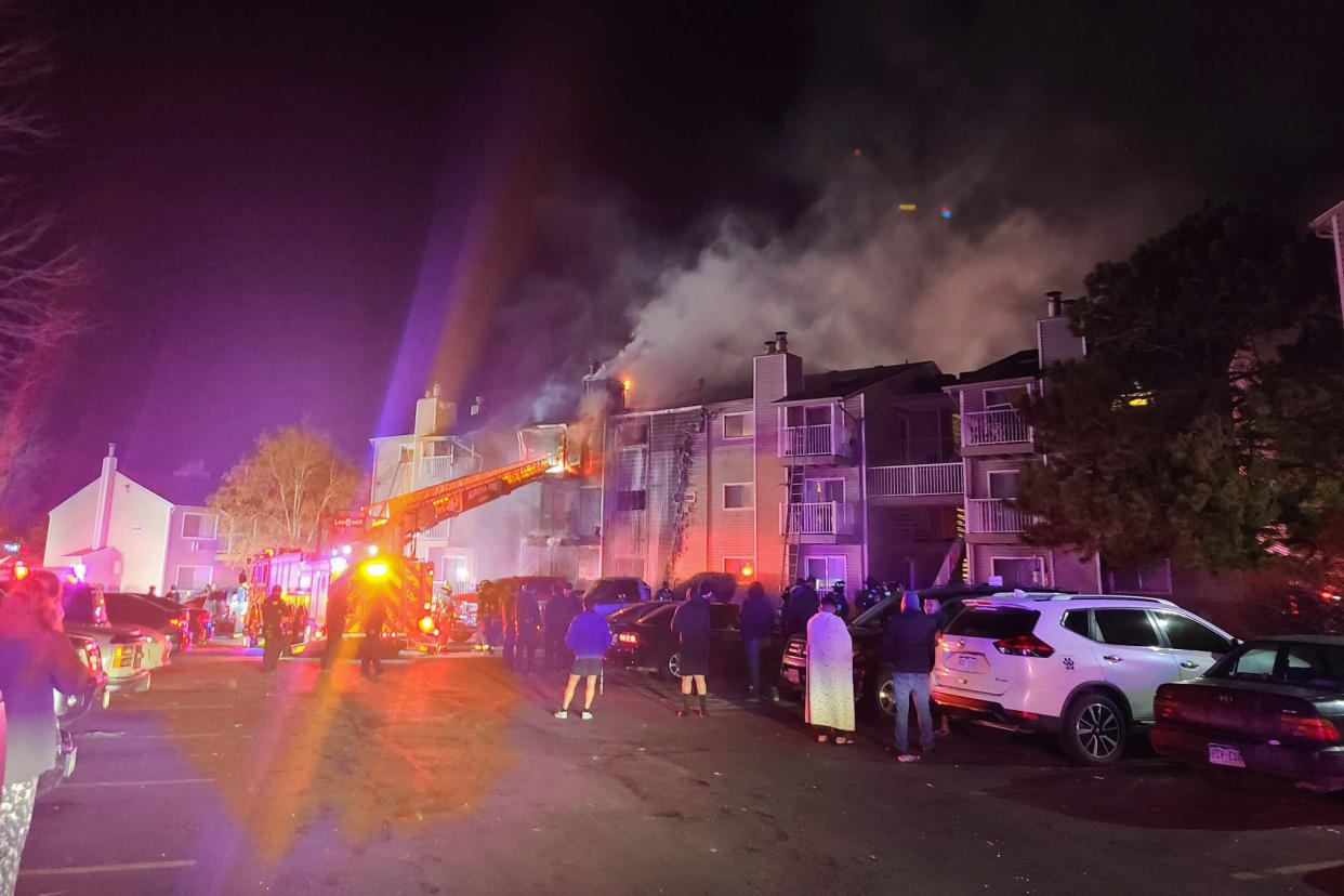 In this photo released by the Aurora Fire Rescue is the scene where a fire swept through a three-story apartment building in Aurora, Colo., Monday, Jan. 24, 2022. Officials in suburban Denver say that a child died after firefighters rescued people unable to escape on their own before dawn. (Aurora Fire Rescue via AP)