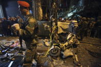 Residents and Lebanese army members inspect a damaged area caused by two explosions in Beirut's southern suburbs, Lebanon November 12, 2015. REUTERS/Khalil Hassan