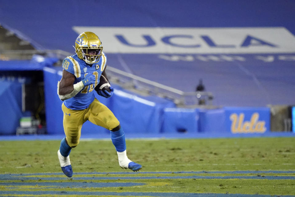 UCLA running back Demetric Felton Jr. carries against Arizona during the second half of an NCAA college football game Saturday, Nov. 28, 2020, in Pasadena, Calif. (AP Photo/Marcio Jose Sanchez)