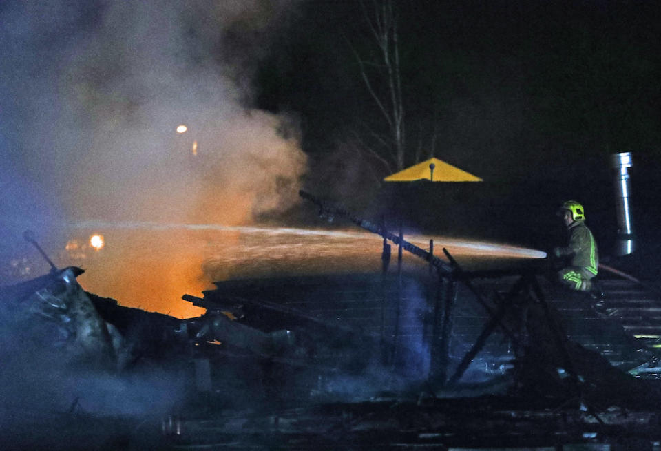 A firefighter at the scene of the fire (Picture: PA)