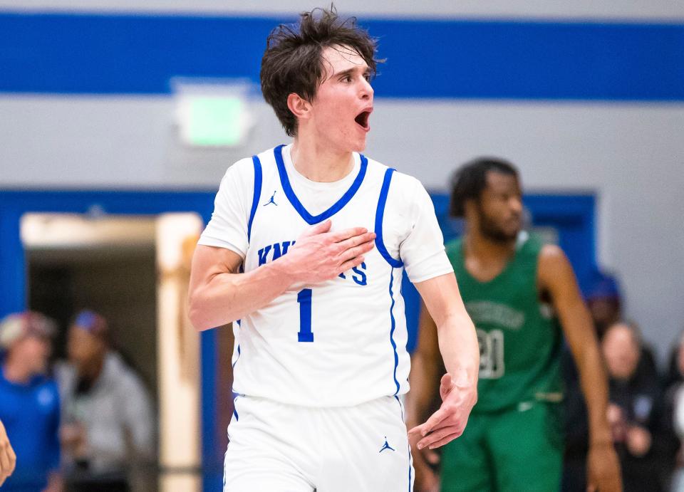 Marian's Deaglan Sullivan (1) celebrates during the Washington vs. Marian boys basketball game Friday, Jan. 27, 2023 at Marian High School.