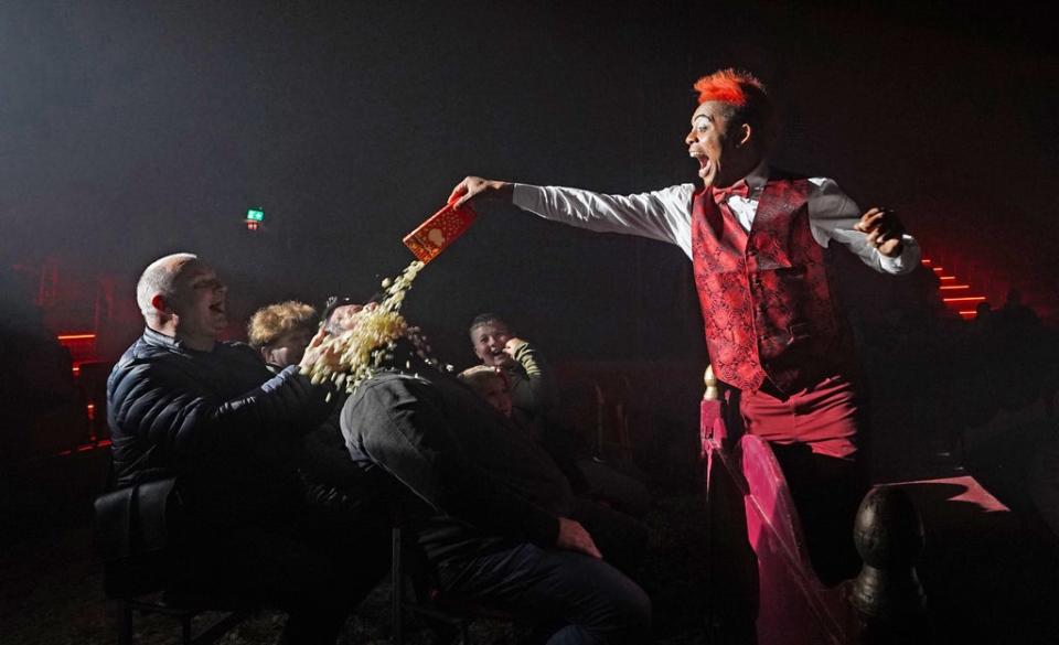 Walison the Clown empties popcorn over and unsuspecting member of the audience during Tom Duffy’s Circus, which has begun touring Ireland again with a show in Drogheda having been shut down by the Covid-19 lockdown. Picture date: Saturday November 6, 2021. PA Photo. See PA story IRISH Circus . Photo credit should read: Niall Carson/PA Wire