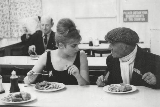 Actress Edina Ronay and her uncle Leny tuck into fish and chips in a shop in the Mile End Road, East London (28 April 1963) (George Elam/ANL/Shutterstock)